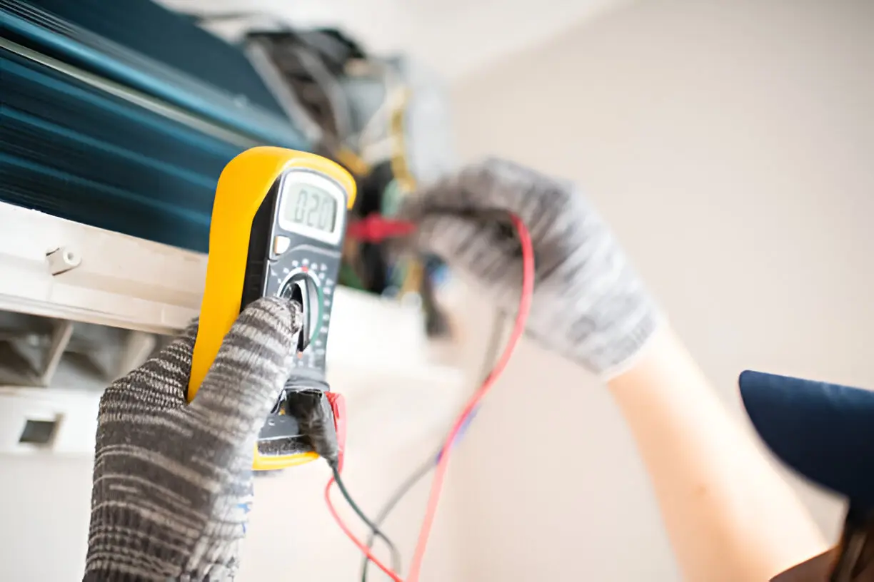 Emergency AC repair technician fixing a broken air conditioner in Orlando